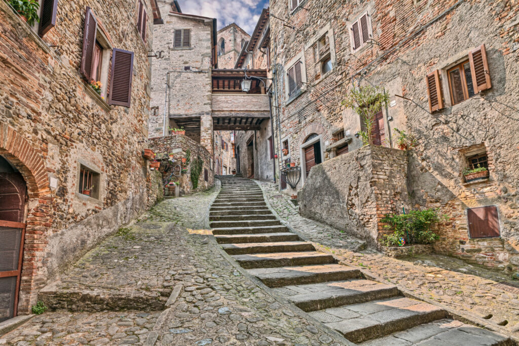 Anghiari, Arezzo, Tuscany, Italy: picturesque old narrow alley with staircase in the medieval village
