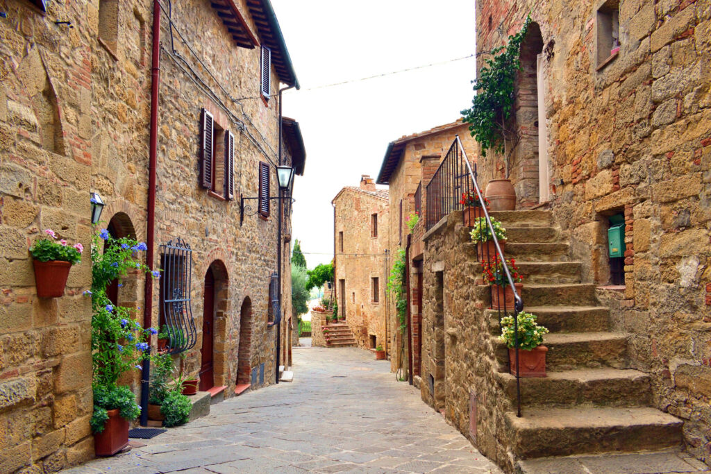 view of characteristic Tuscan stone houses in the village of medieval origin of Monticchiello near Siena, Italy