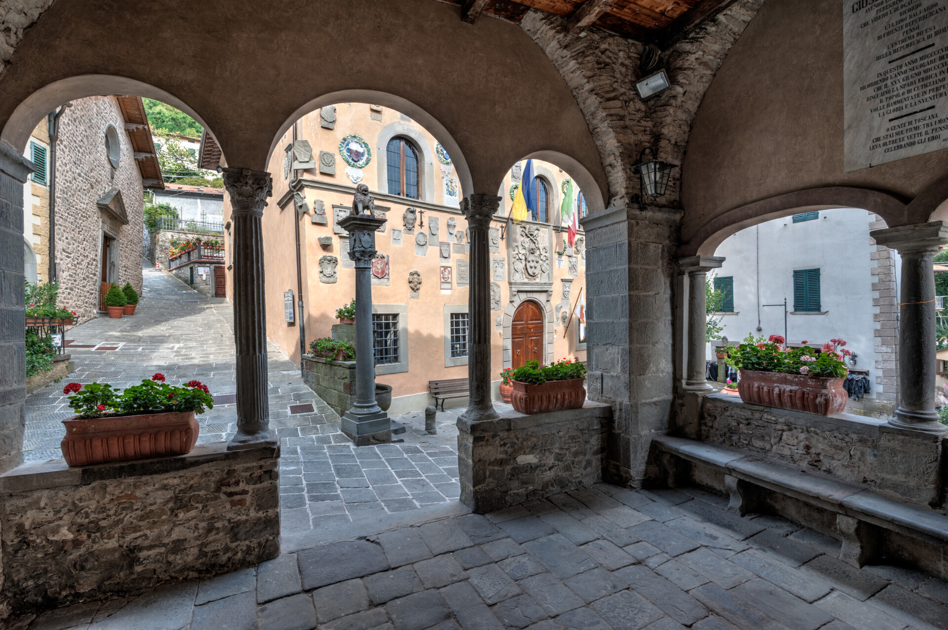 The medieval village of Cutigliano, the Palazzo di Giustizia and the little lodge in front of it