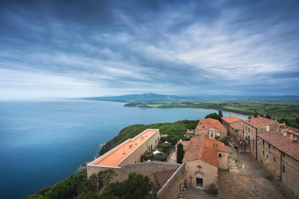 Populonia old village and Baratti gulf panoramic aerial view from fortress tower. Piombino, Livorno province, Tuscany region, Italy.
