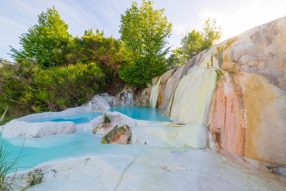 Bagni San Filippo. Geothermal pool and hot spring in Tuscany, Italy. Bagni San Filippo natural thermal waterfall in the morning with no people. The White Whale amidst forest.