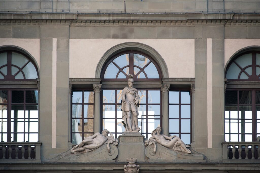 Uffizi gallery in Florence, Italy. Detail of window and statue.